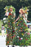 Stilt walkers at a flower show 