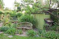 Seating area in the country garden at the tool shed 