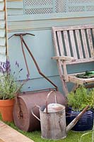 Antique lawn roller and watering can 