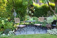 Seating area with hydrangeas, Hydrangea arborescens Annabelle 