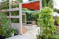 Terrace with privacy screen and vegetables in pots 