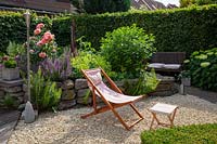 Deck chair in small garden 