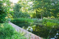 Swimming pond with filter zone 