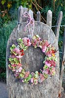 Wreath of flowers and rose hips 