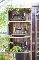 Shelf with old sewing machines 