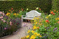 Seating area at the bed with annuals and dahlias 