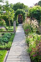 Wooden walkway in the garden 