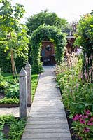 Wooden walkway in the garden 