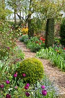 Spring garden with yew columns 