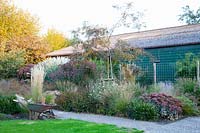 Bed with grasses and perennials in September 