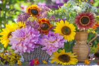 Summer flower arrangement with dahlias, eupatorium, sunflowers and wildflowers.