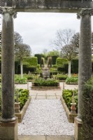 View from the Triumphal Arch into the Rose Garden and the Silver Jubilee Garden. Tulips planted in beds. April. Spring.